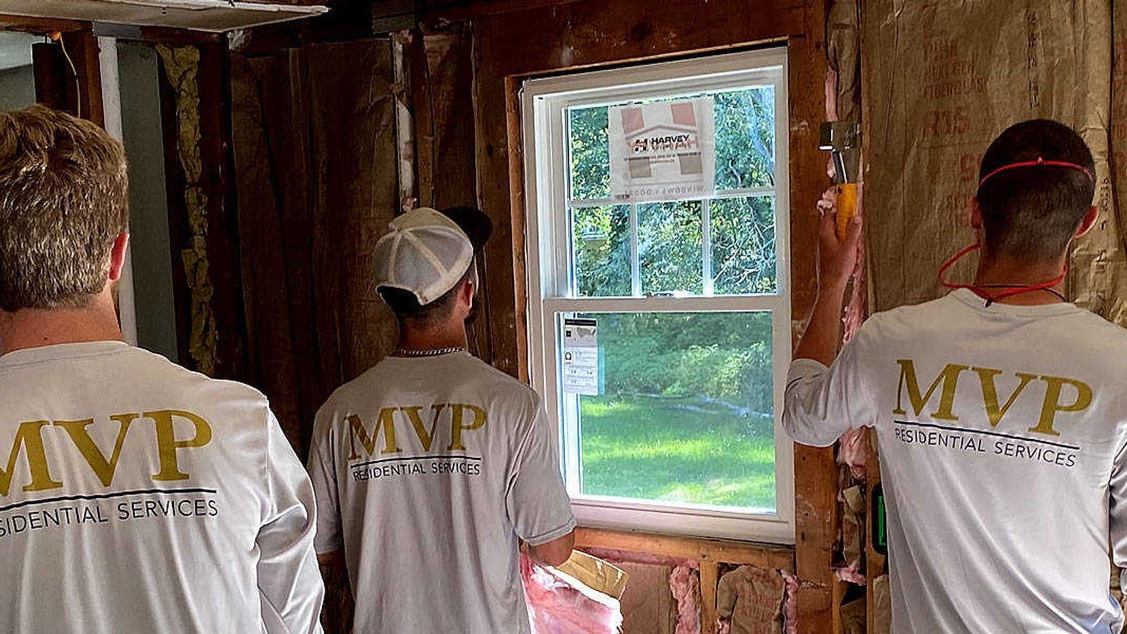 MVP Residential Services crew installing windows on a remodel
